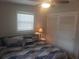 Comfortable bedroom featuring a ceiling fan, window, and closet at 10160 118Th Ave, Largo, FL 33773
