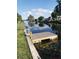 A scenic waterfront view with a new dock for enjoying outdoor activities and serene water reflections at 10160 118Th Ave, Largo, FL 33773
