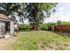 Backyard featuring large trees and green grass at 11109 Sumner Rd, Wimauma, FL 33598