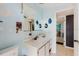 Bathroom featuring a sink, mirror, toilet, and accessories with easy access at 11109 Sumner Rd, Wimauma, FL 33598