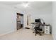Bedroom with built in storage and tile floors at 11109 Sumner Rd, Wimauma, FL 33598