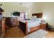 Bedroom with wood furniture and a flat screen television on the wall at 11109 Sumner Rd, Wimauma, FL 33598