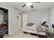 Neutral bedroom with light gray walls, tile floors, ceiling fan, and closet for storage at 11109 Sumner Rd, Wimauma, FL 33598