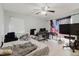 Bedroom with bed, computer, television and ceiling fan at 11109 Sumner Rd, Wimauma, FL 33598