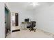 Bedroom with adjoining bathroom and tile floors at 11109 Sumner Rd, Wimauma, FL 33598