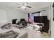 Bedroom with bed, computer, television and ceiling fan at 11109 Sumner Rd, Wimauma, FL 33598