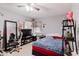 Cozy bedroom featuring a study area, natural light, and comfortable space at 11109 Sumner Rd, Wimauma, FL 33598