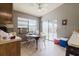 Bright dining area with tile flooring, modern lighting, and sliding door access to the outside at 11109 Sumner Rd, Wimauma, FL 33598