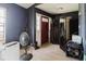 Front entryway with a red door and hardwood-style flooring at 11109 Sumner Rd, Wimauma, FL 33598