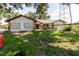 Front of the house with stone and cinderblock design and sparse landscaping at 11109 Sumner Rd, Wimauma, FL 33598