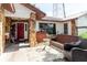 Front entrance and small porch with furniture at 11109 Sumner Rd, Wimauma, FL 33598