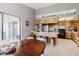 Bright, airy kitchen with tile flooring, wooden cabinets, and a breakfast bar area at 11109 Sumner Rd, Wimauma, FL 33598