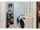 Laundry room featuring washer, dryer, and built in shelving at 11109 Sumner Rd, Wimauma, FL 33598