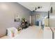 Living room with neutral walls, tile flooring, ceiling fan, and decorations at 11109 Sumner Rd, Wimauma, FL 33598