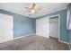 Serene bedroom with carpet, closet, and lots of natural light at 1111 Chatham Ct, Safety Harbor, FL 34695
