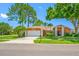 Charming single-Gathering home with a well-manicured lawn and attached garage at 1111 Chatham Ct, Safety Harbor, FL 34695