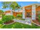 Beautiful front yard with lush landscaping, a well-maintained lawn, and a welcoming entrance at 1111 Chatham Ct, Safety Harbor, FL 34695