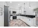 Kitchen featuring stainless steel appliances, granite counters, and bright white cabinetry at 1111 Chatham Ct, Safety Harbor, FL 34695