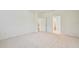 A bright bedroom features neutral carpet and light walls, offering a clean and airy feel at 11303 Striped Bass Ct, New Port Richey, FL 34654