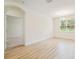 A brightly lit empty dining room with a view of a carpeted room at 11303 Striped Bass Ct, New Port Richey, FL 34654