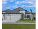 Beautiful one story home with a two-car garage, well manicured lawn, and a nice landscape at 11324 Striped Bass Ct, New Port Richey, FL 34654
