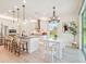 Open concept kitchen, dining and living area featuring stainless appliances and lots of natural light at 11324 Striped Bass Ct, New Port Richey, FL 34654