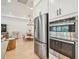 Gourmet kitchen with stainless steel appliances, ample cabinets, and a view of the main living area at 11324 Striped Bass Ct, New Port Richey, FL 34654