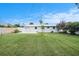 Expansive backyard offering a large green space and a full privacy fence at 11416 126Th N Ave, Largo, FL 33778