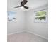 Well-lit bedroom with two windows and a ceiling fan at 11416 126Th N Ave, Largo, FL 33778