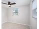 Bright bedroom featuring tile flooring and window views at 11416 126Th N Ave, Largo, FL 33778