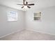 Bright bedroom featuring tile flooring and two windows at 11416 126Th N Ave, Largo, FL 33778