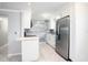 Updated kitchen featuring stainless steel appliances and white cabinets at 11416 126Th N Ave, Largo, FL 33778