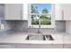 Kitchen sink and countertop featuring a window to the backyard at 11416 126Th N Ave, Largo, FL 33778