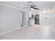 Open-concept living area with tile floors seamlessly connecting to the modern kitchen at 11416 126Th N Ave, Largo, FL 33778