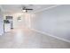 Spacious living room featuring neutral tile flooring and abundant natural light at 11416 126Th N Ave, Largo, FL 33778