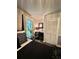 Stylish bedroom features modern decor, geometric-patterned pillows, and ample natural light from the window at 11760 Ashley Ct, Seminole, FL 33772