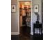 Walk-in closet featuring custom shelving, hanging racks, and chandelier lighting at 11760 Ashley Ct, Seminole, FL 33772