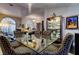 Bright dining area with a clear glass table, patterned chairs, and built-in china cabinet at 11760 Ashley Ct, Seminole, FL 33772