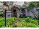 Beautiful home featuring lush landscaping, brick accents, and an inviting entrance at 11760 Ashley Ct, Seminole, FL 33772