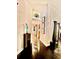 Stylish hallway featuring hardwood floors, decorative wall panels, and artful accents at 11760 Ashley Ct, Seminole, FL 33772