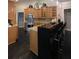 Spacious kitchen with stainless steel appliances, wooden cabinets, and counter with bar stools at 11760 Ashley Ct, Seminole, FL 33772
