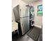 Functional laundry room equipped with modern washer/dryer units, sink, and practical storage solutions at 11760 Ashley Ct, Seminole, FL 33772