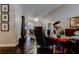 Intriguing living room with dark wood floors, eye catching art pieces, and an elegant chandelier at 11760 Ashley Ct, Seminole, FL 33772