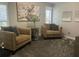 Stylish living room showcasing comfortable seating, refined decor, and natural light from large window at 11760 Ashley Ct, Seminole, FL 33772