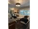 Inviting living room with large window and comfortable white sectional sofa at 11760 Ashley Ct, Seminole, FL 33772
