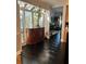 Sunroom with cabinet, shutters, and view into dining room at 11760 Ashley Ct, Seminole, FL 33772