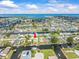 Waterfront home with private dock highlighted by an arrow, in a canal community near Tampa Bay at 13316 Carol Dr, Hudson, FL 34667