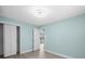 Bedroom features updated vinyl plank flooring and a closet with added shelving at 13316 Carol Dr, Hudson, FL 34667