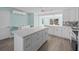 Stylish kitchen with a large center island and a white cabinet and drawer combination at 13316 Carol Dr, Hudson, FL 34667