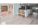 Spacious living room connected to the updated kitchen, patio entrance, and outdoor living area at 13316 Carol Dr, Hudson, FL 34667